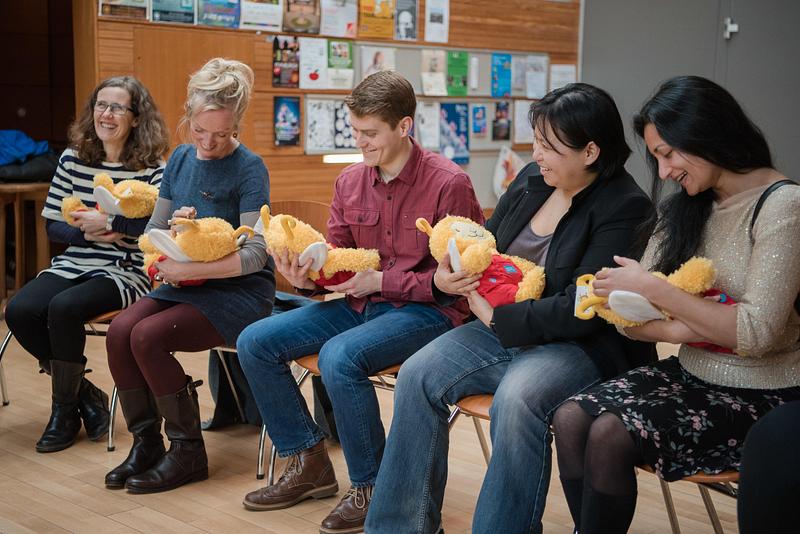 A group of adults taking part in a Bookbug training session