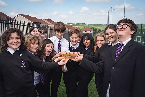 A group of pupils with their Reading Schools trophy