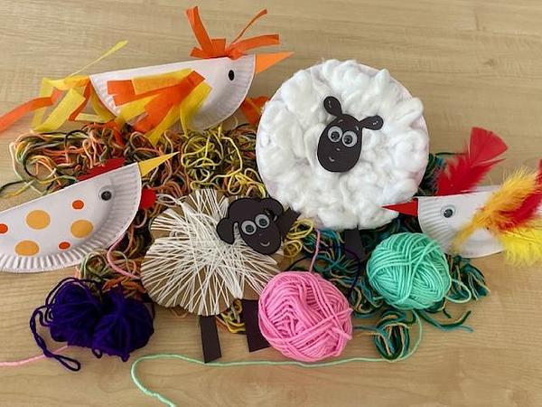 Homemade craft animals from Mavis the Bravest, featuring hens and sheep, and balls of yarn