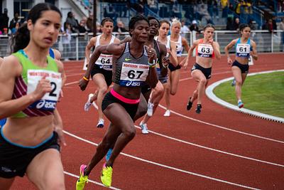 Athletic runners racing round the track