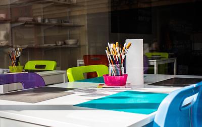 Classroom table with multi-coloured chairs