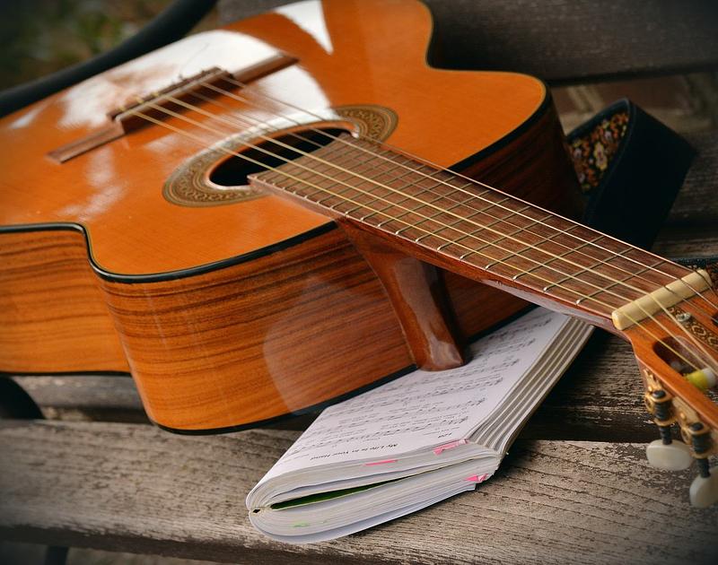 A guitar and sheet music book